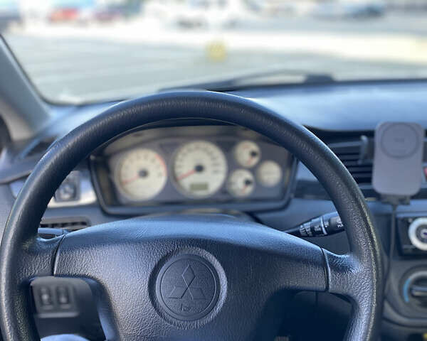 Сірий Міцубісі Lancer, об'ємом двигуна 1.58 л та пробігом 270 тис. км за 1999 $, фото 9 на Automoto.ua