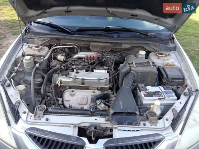 Серый Мицубиси Лансер, объемом двигателя 1.6 л и пробегом 244 тыс. км за 4000 $, фото 5 на Automoto.ua