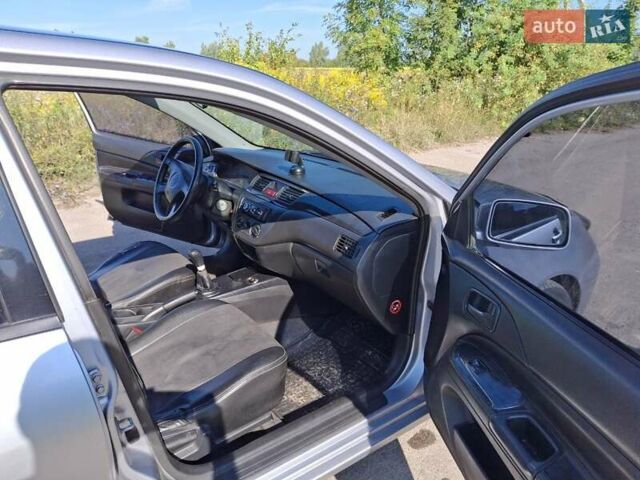 Серый Мицубиси Лансер, объемом двигателя 1.58 л и пробегом 270 тыс. км за 3800 $, фото 2 на Automoto.ua