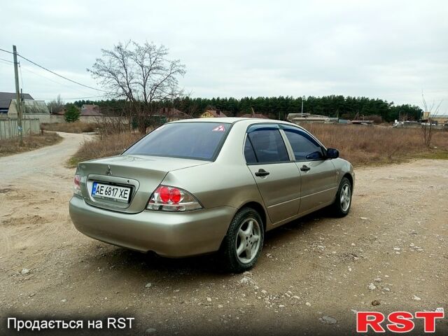Сірий Міцубісі Lancer, об'ємом двигуна 1.3 л та пробігом 223 тис. км за 4300 $, фото 4 на Automoto.ua