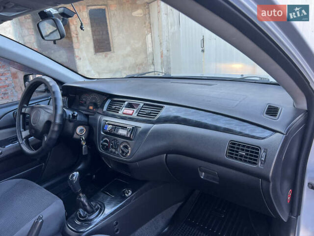 Серый Мицубиси Лансер, объемом двигателя 1.6 л и пробегом 320 тыс. км за 3650 $, фото 29 на Automoto.ua