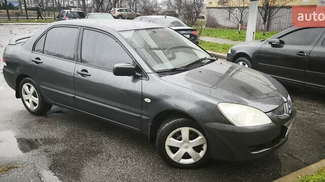 Сірий Міцубісі Lancer, об'ємом двигуна 1.58 л та пробігом 110 тис. км за 2999 $, фото 13 на Automoto.ua