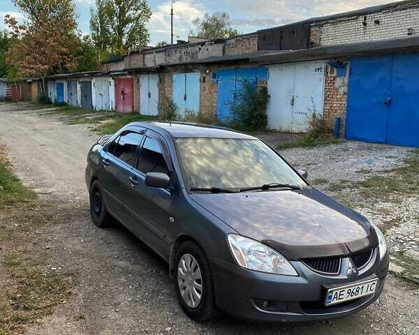 Сірий Міцубісі Lancer, об'ємом двигуна 1.58 л та пробігом 307 тис. км за 3800 $, фото 1 на Automoto.ua
