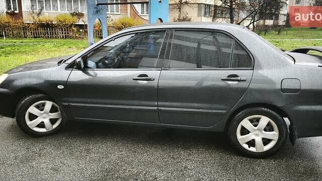 Сірий Міцубісі Lancer, об'ємом двигуна 1.58 л та пробігом 110 тис. км за 2999 $, фото 4 на Automoto.ua