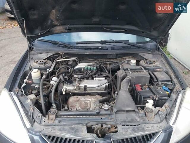 Сірий Міцубісі Lancer, об'ємом двигуна 1.58 л та пробігом 531 тис. км за 2828 $, фото 13 на Automoto.ua