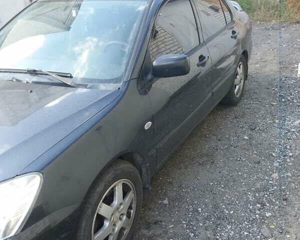 Сірий Міцубісі Lancer, об'ємом двигуна 1.58 л та пробігом 531 тис. км за 2828 $, фото 3 на Automoto.ua