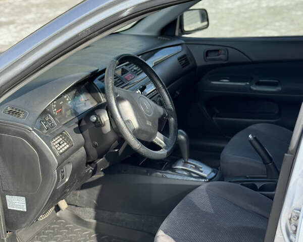 Сірий Міцубісі Lancer, об'ємом двигуна 1.6 л та пробігом 260 тис. км за 3899 $, фото 7 на Automoto.ua