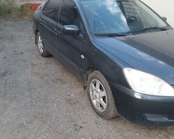 Сірий Міцубісі Lancer, об'ємом двигуна 1.58 л та пробігом 531 тис. км за 2828 $, фото 6 на Automoto.ua