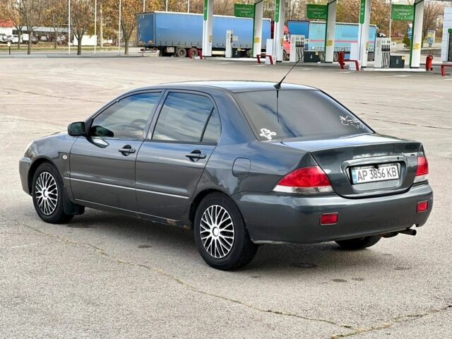 Серый Мицубиси Лансер, объемом двигателя 1.6 л и пробегом 490 тыс. км за 1799 $, фото 7 на Automoto.ua