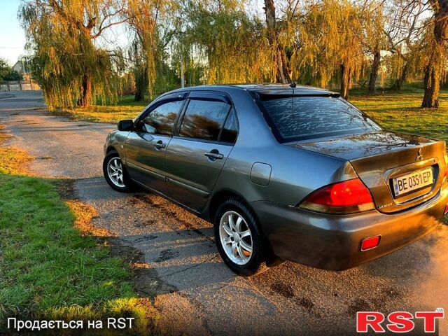 Серый Мицубиси Лансер, объемом двигателя 1.6 л и пробегом 275 тыс. км за 3000 $, фото 7 на Automoto.ua