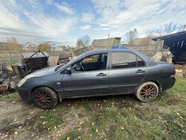 Серый Мицубиси Лансер, объемом двигателя 1.6 л и пробегом 200 тыс. км за 2400 $, фото 6 на Automoto.ua