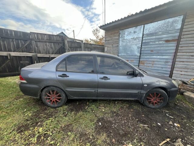 Серый Мицубиси Лансер, объемом двигателя 1.6 л и пробегом 200 тыс. км за 2400 $, фото 2 на Automoto.ua