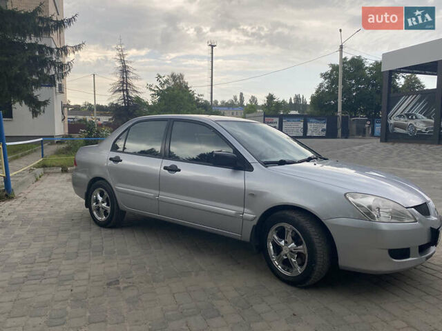 Сірий Міцубісі Lancer, об'ємом двигуна 1.58 л та пробігом 268 тис. км за 3799 $, фото 3 на Automoto.ua