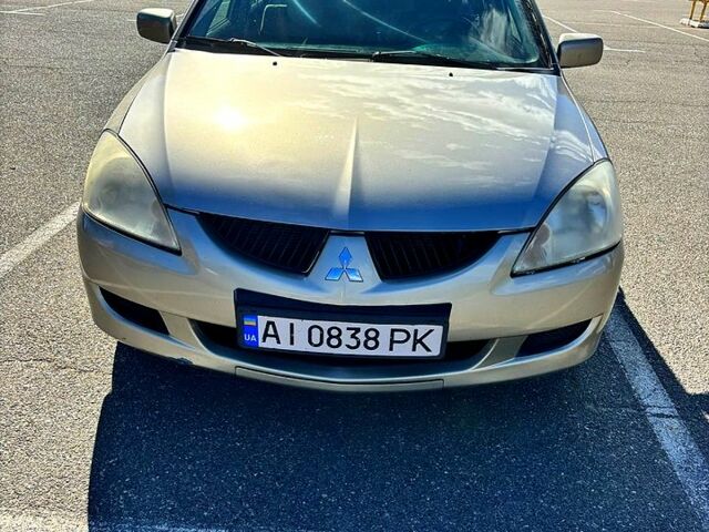 Серый Мицубиси Лансер, объемом двигателя 1.3 л и пробегом 245 тыс. км за 3000 $, фото 12 на Automoto.ua