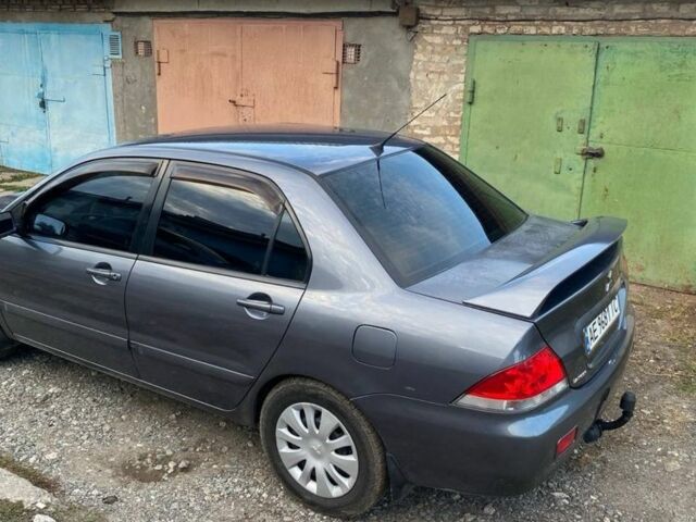 Сірий Міцубісі Lancer, об'ємом двигуна 1.6 л та пробігом 307 тис. км за 3700 $, фото 4 на Automoto.ua