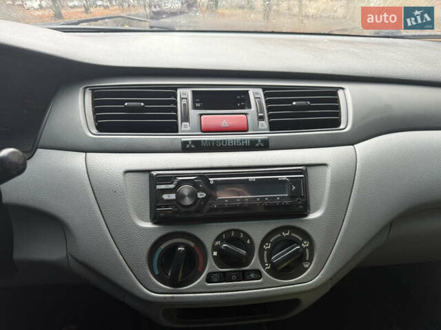 Серый Мицубиси Лансер, объемом двигателя 1.29 л и пробегом 263 тыс. км за 3400 $, фото 12 на Automoto.ua