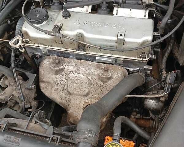 Серый Мицубиси Лансер, объемом двигателя 1.6 л и пробегом 372 тыс. км за 3500 $, фото 6 на Automoto.ua