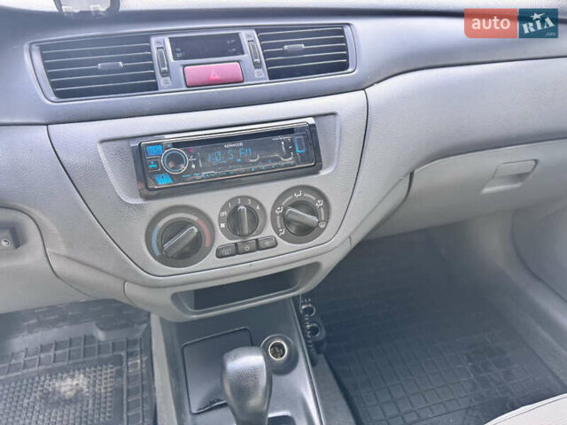 Сірий Міцубісі Lancer, об'ємом двигуна 1.3 л та пробігом 450 тис. км за 2650 $, фото 12 на Automoto.ua