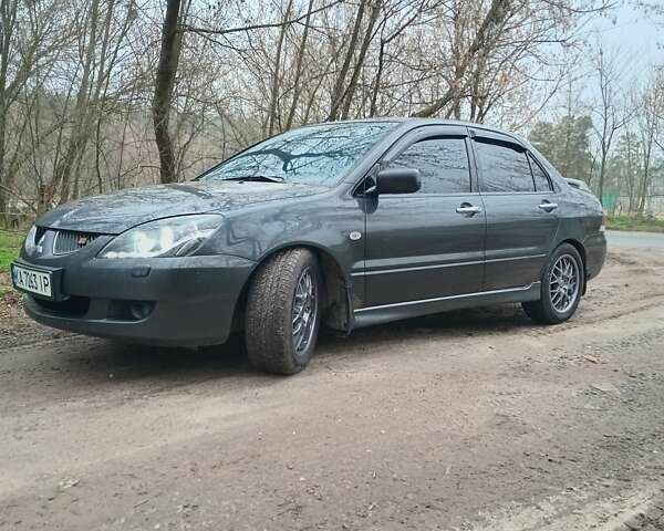 Сірий Міцубісі Lancer, об'ємом двигуна 1.58 л та пробігом 360 тис. км за 4000 $, фото 9 на Automoto.ua