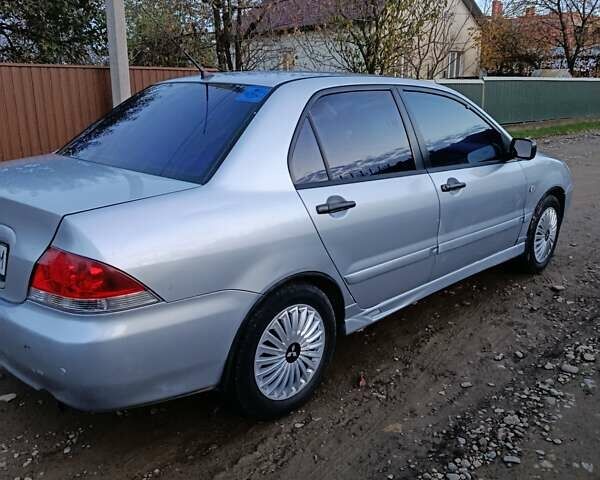 Мицубиси Лансер 2004 в Черновцах на Automoto.ua Серый Мицубиси Лансер, объемом двигателя 1.58 л и пробегом 439 тыс. км за 2750 $, фото 12 на Automoto.ua