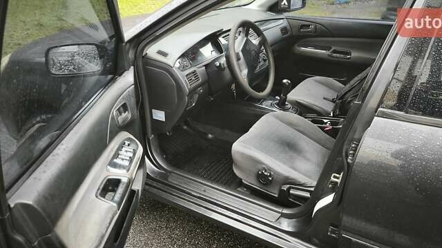 Сірий Міцубісі Lancer, об'ємом двигуна 1.58 л та пробігом 110 тис. км за 2999 $, фото 14 на Automoto.ua