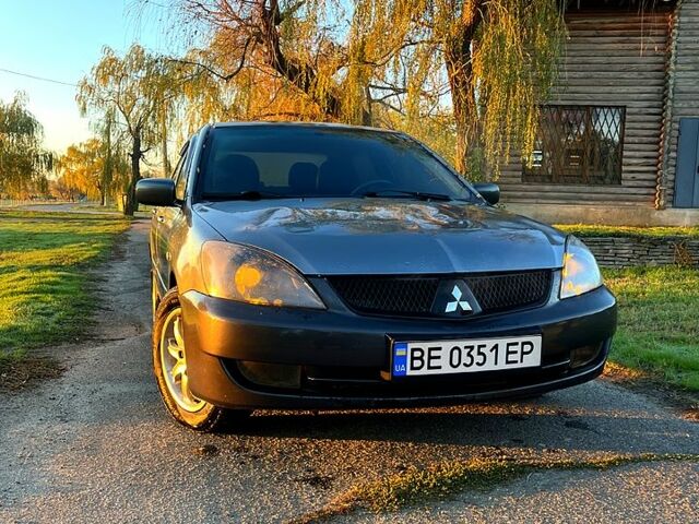 Серый Мицубиси Лансер, объемом двигателя 1.6 л и пробегом 275 тыс. км за 3000 $, фото 1 на Automoto.ua