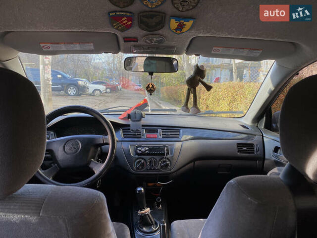 Сірий Міцубісі Lancer, об'ємом двигуна 1.3 л та пробігом 376 тис. км за 3700 $, фото 9 на Automoto.ua