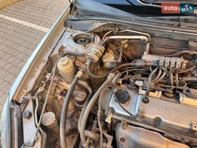 Сірий Міцубісі Lancer, об'ємом двигуна 1.3 л та пробігом 450 тис. км за 2750 $, фото 18 на Automoto.ua