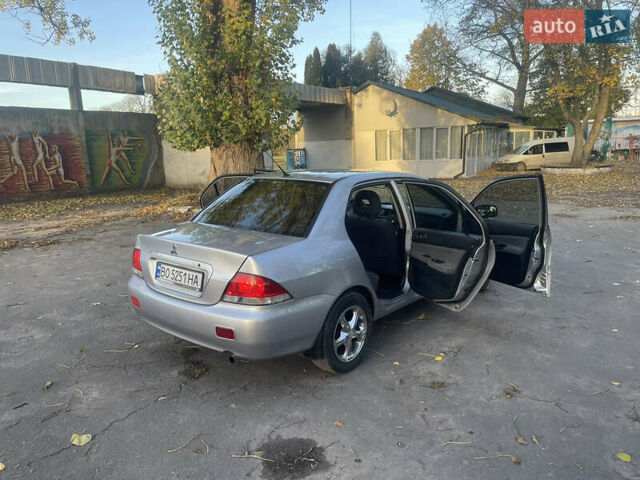 Сірий Міцубісі Lancer, об'ємом двигуна 1.58 л та пробігом 271 тис. км за 3000 $, фото 17 на Automoto.ua