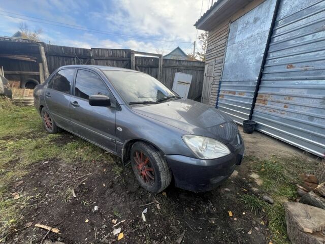 Серый Мицубиси Лансер, объемом двигателя 1.6 л и пробегом 200 тыс. км за 2400 $, фото 1 на Automoto.ua