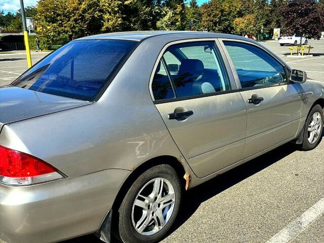 Серый Мицубиси Лансер, объемом двигателя 1.3 л и пробегом 245 тыс. км за 3000 $, фото 11 на Automoto.ua