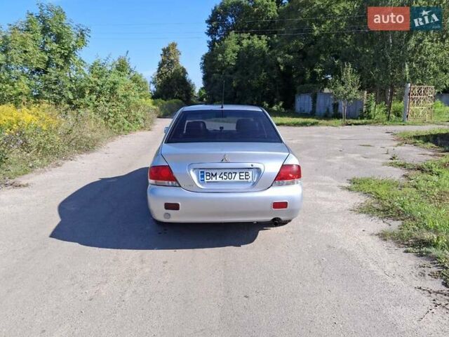 Серый Мицубиси Лансер, объемом двигателя 1.58 л и пробегом 270 тыс. км за 3800 $, фото 6 на Automoto.ua