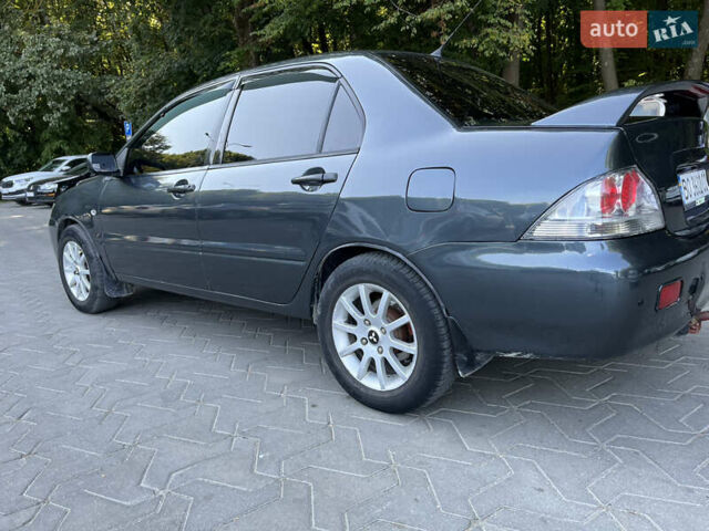 Сірий Міцубісі Lancer, об'ємом двигуна 1.58 л та пробігом 300 тис. км за 3800 $, фото 4 на Automoto.ua