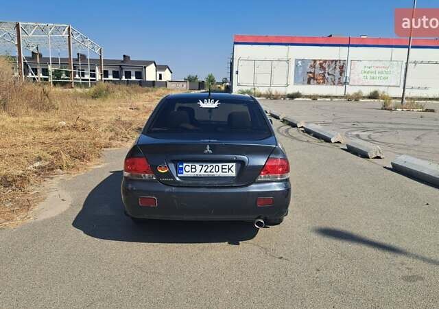 Мицубиси Лансер 2004 в Чернигове на Automoto.ua Серый Мицубиси Лансер, объемом двигателя 1.58 л и пробегом 320 тыс. км за 3900 $, фото 11 на Automoto.ua