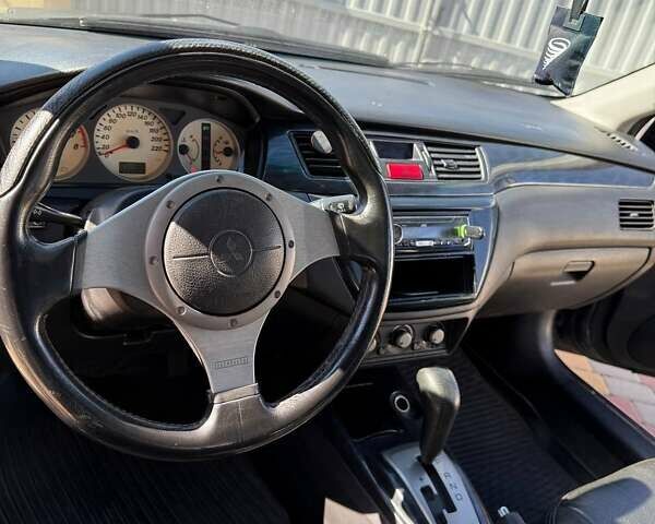 Мицубиси Лансер 2004 в Одессе на Automoto.ua Серый Мицубиси Лансер, объемом двигателя 1.58 л и пробегом 236 тыс. км за 5300 $, фото 1 на Automoto.ua