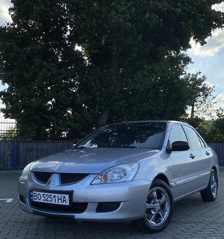 Сірий Міцубісі Lancer, об'ємом двигуна 1.58 л та пробігом 270 тис. км за 1999 $, фото 1 на Automoto.ua