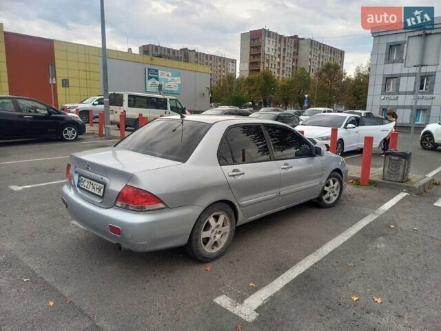 Серый Мицубиси Лансер, объемом двигателя 1.58 л и пробегом 359 тыс. км за 3800 $, фото 4 на Automoto.ua