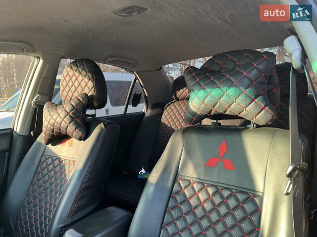 Сірий Міцубісі Lancer, об'ємом двигуна 1.58 л та пробігом 300 тис. км за 3800 $, фото 19 на Automoto.ua