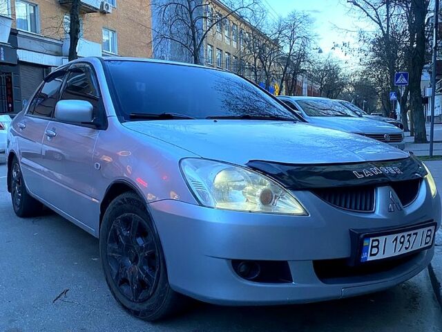 Сірий Міцубісі Lancer, об'ємом двигуна 1.6 л та пробігом 380 тис. км за 4600 $, фото 4 на Automoto.ua