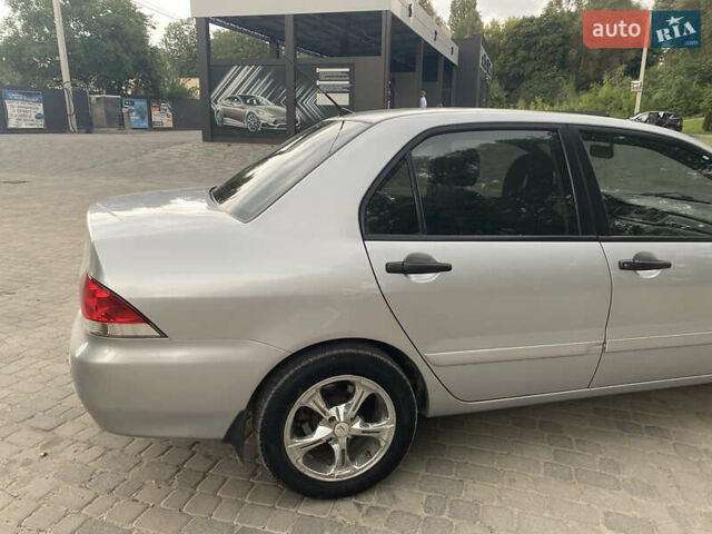 Сірий Міцубісі Lancer, об'ємом двигуна 1.58 л та пробігом 268 тис. км за 3799 $, фото 4 на Automoto.ua