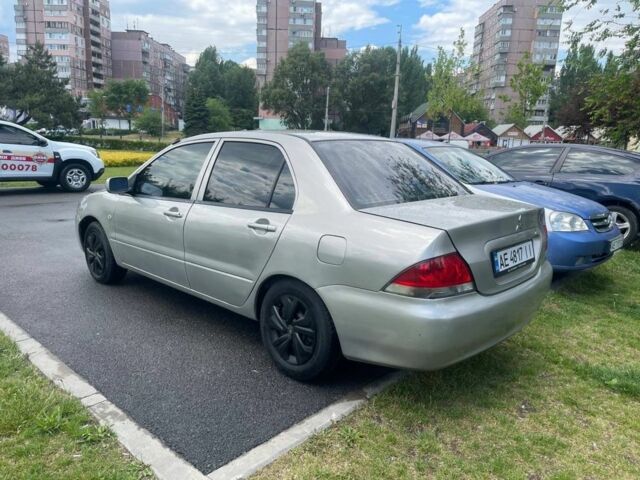 Сірий Міцубісі Lancer, об'ємом двигуна 1.3 л та пробігом 216 тис. км за 2999 $, фото 3 на Automoto.ua