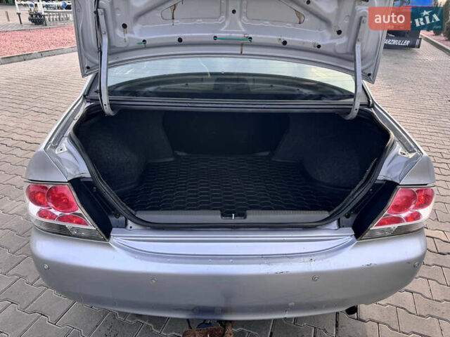 Серый Мицубиси Лансер, объемом двигателя 1.3 л и пробегом 450 тыс. км за 2999 $, фото 21 на Automoto.ua