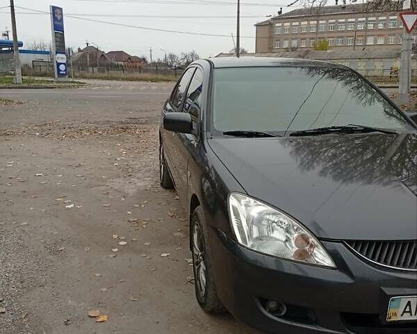 Серый Мицубиси Лансер, объемом двигателя 1.6 л и пробегом 372 тыс. км за 3500 $, фото 7 на Automoto.ua