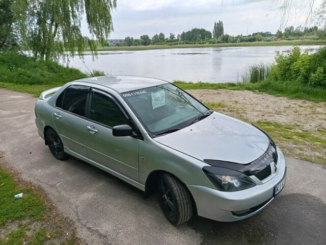 Сірий Міцубісі Lancer, об'ємом двигуна 2 л та пробігом 240 тис. км за 3500 $, фото 4 на Automoto.ua