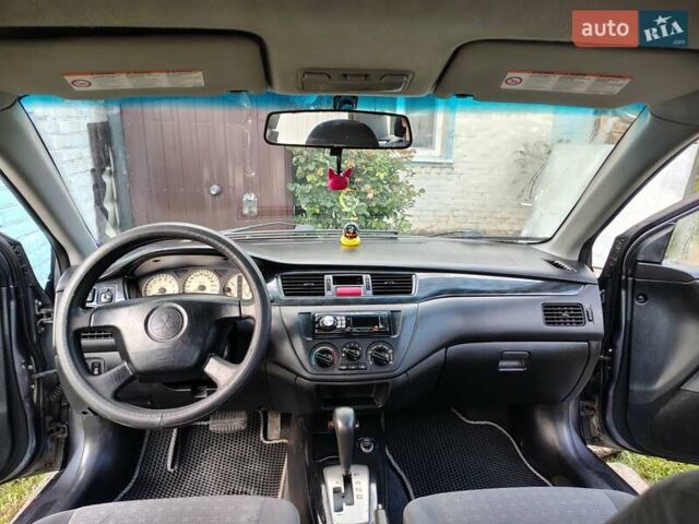 Сірий Міцубісі Lancer, об'ємом двигуна 1.58 л та пробігом 300 тис. км за 4200 $, фото 2 на Automoto.ua