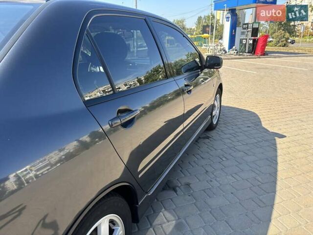 Сірий Міцубісі Lancer, об'ємом двигуна 1.58 л та пробігом 167 тис. км за 5100 $, фото 12 на Automoto.ua