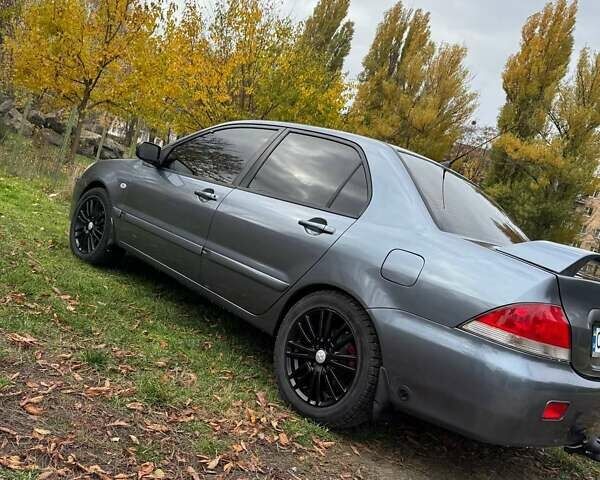 Серый Мицубиси Лансер, объемом двигателя 1.58 л и пробегом 313 тыс. км за 4650 $, фото 1 на Automoto.ua