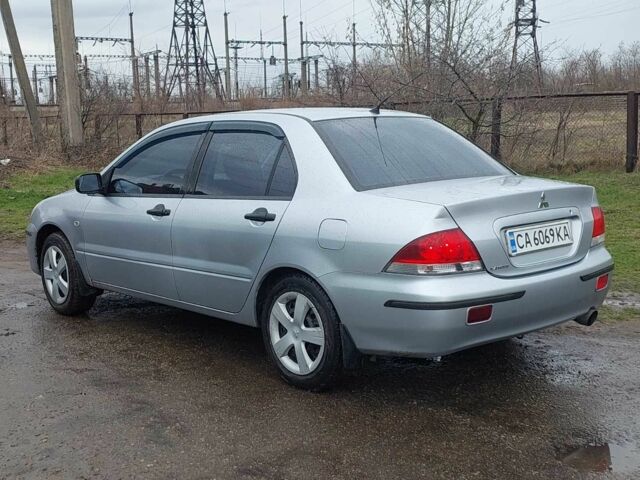 Сірий Міцубісі Lancer, об'ємом двигуна 0.16 л та пробігом 216 тис. км за 4150 $, фото 1 на Automoto.ua