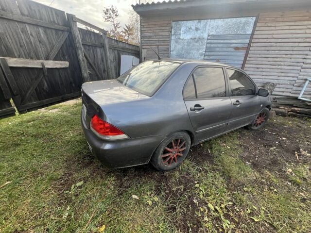 Серый Мицубиси Лансер, объемом двигателя 1.6 л и пробегом 200 тыс. км за 2400 $, фото 3 на Automoto.ua