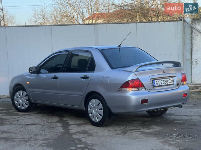 Серый Мицубиси Лансер, объемом двигателя 1.6 л и пробегом 320 тыс. км за 3650 $, фото 18 на Automoto.ua